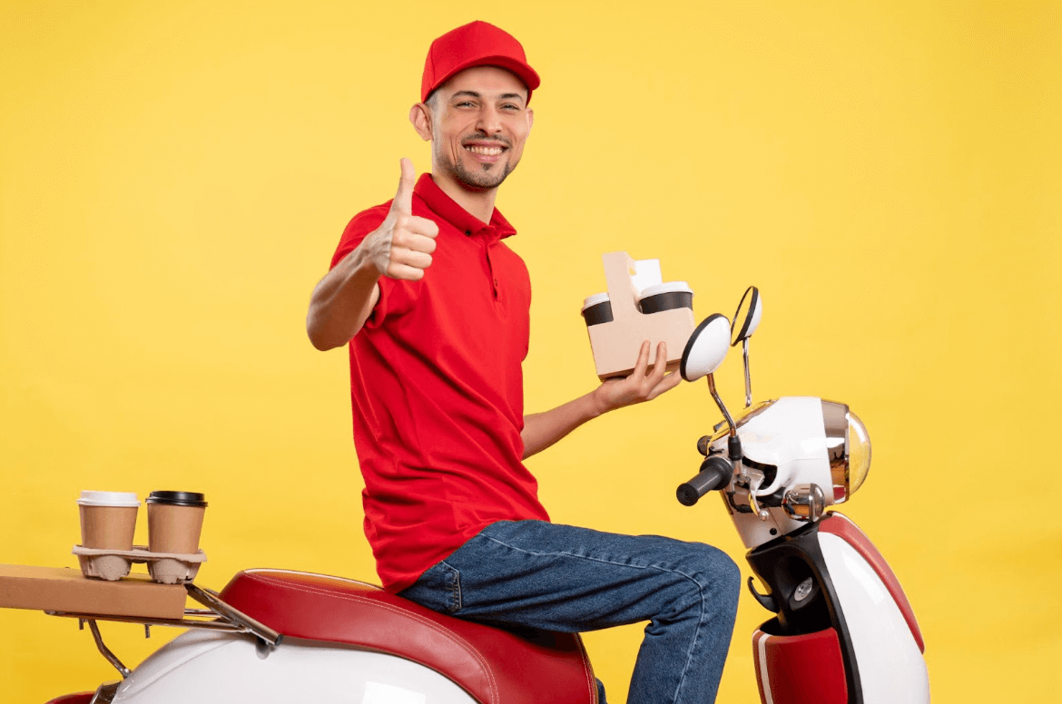 delivery driver smiling and giving a thumbs up